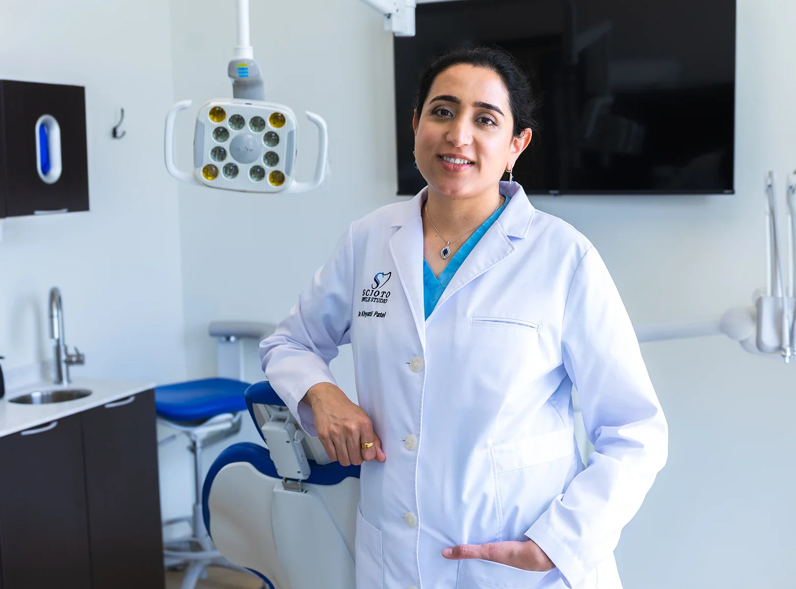 Dr. Khyati Patel, lead dentist at Scioto Smile Studio, smiling confidently in the clinic