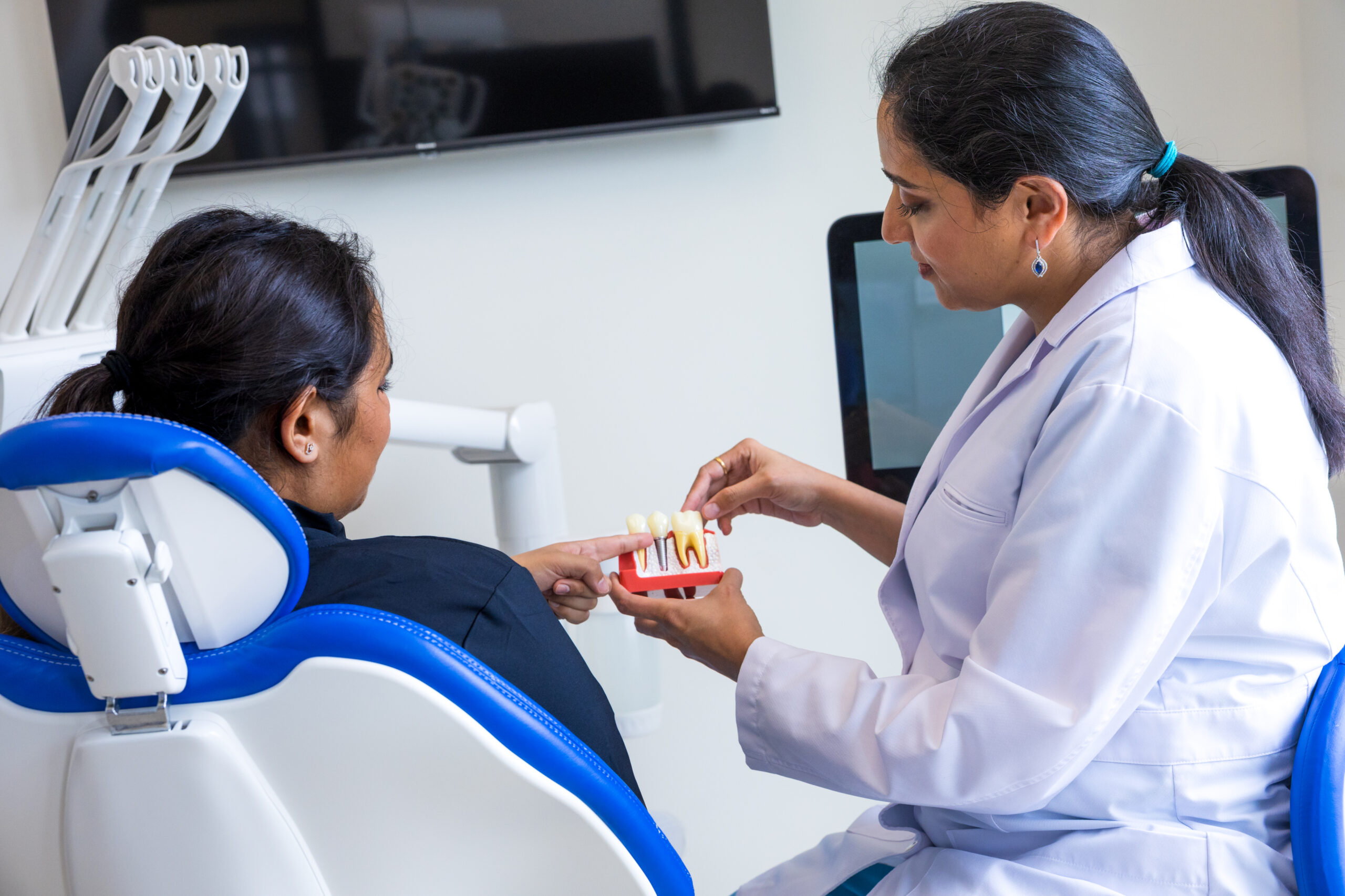 Dr. Patel explaining implant to the patient