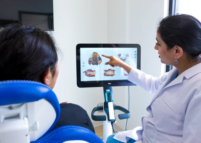 Dr. Khyati Patel discussing a dental procedure with a patient at Scioto Smile Studio
