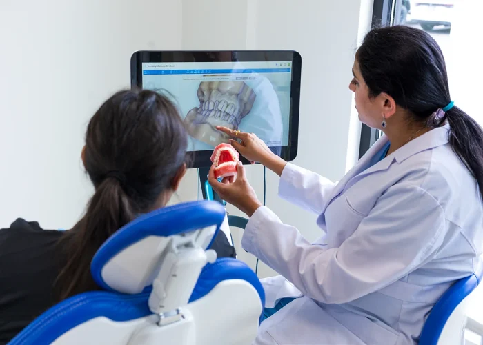 Dr. Khyati Patel explaining a dental procedure to a patient at Scioto Smile Studio